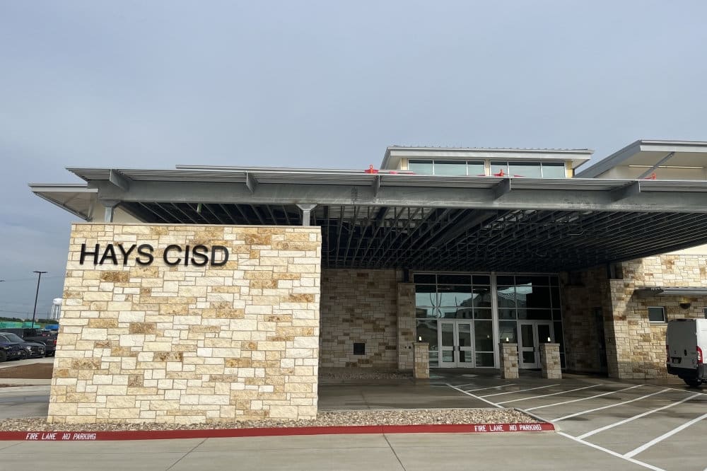 Hays CISD sign and school building